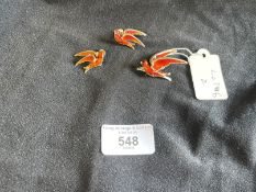 Norwegian Designer: Silver gilt suite consisting of a brooch and a pair of earrings in red enamel in