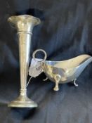 Hallmarked Silver: Plain sauce boat, scroll handle on three feet. Weight 5.4oz. Hallmarked Silver: