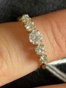 Jewellery: 18K gold five stone diamond ring (0.70 carats total). Ring size L. 2.5g.