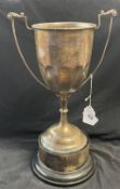 Hallmarked Silver: Trophy, double handles attached to a plastic plinth. Total weight including