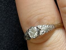Jewellery: Yellow and white metal ring set with a single brilliant cut diamond, estimated weight 0.