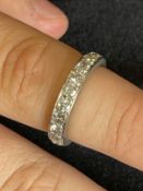 Jewellery: White metal ring set with twenty brilliant cut diamonds as a full eternity ring,