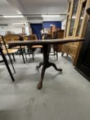 19th cent. Mahogany tilt top dining table on gun barrel supports, tripod club feet.