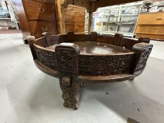20th cent. Traditional Indian Chakki low table, the sides and supports carved profusely with