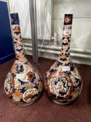 19th cent. Japanese bottle vases decorated in the traditional manner, a pair. (1 restored). 18ins.