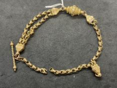 Jewellery: Yellow metal part of a fancy Albert chain, tests as 9ct gold. Length 9ins. 11.8g.