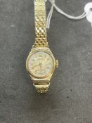 Watches: 9ct gold rotary round silver coloured dial with Arabic numerals