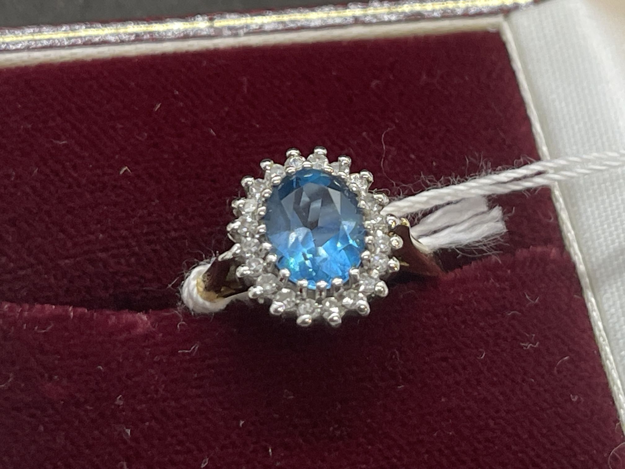 Jewellery: 9ct gold ring central set with an oval cut blue topaz, estimated weight 2.25ct,