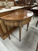 19th cent. Mahogany demi lune tea table inlaid with boxwood stringing, on tapering supports.