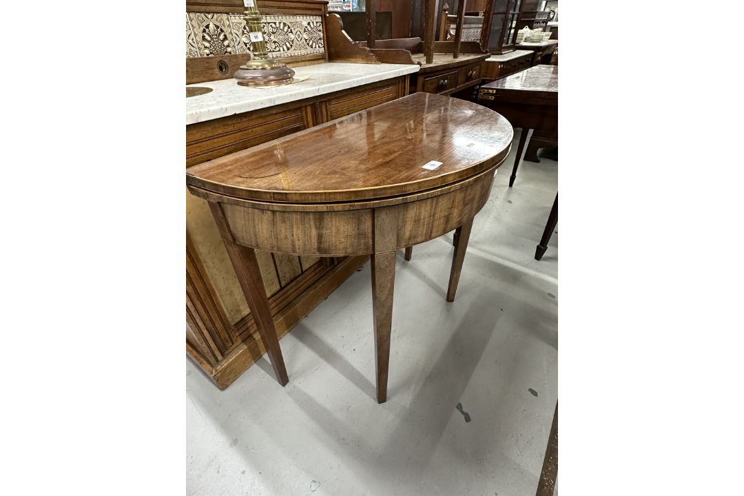 19th cent. Mahogany demi lune tea table inlaid with boxwood stringing, on tapering supports. - Image 1 of 3