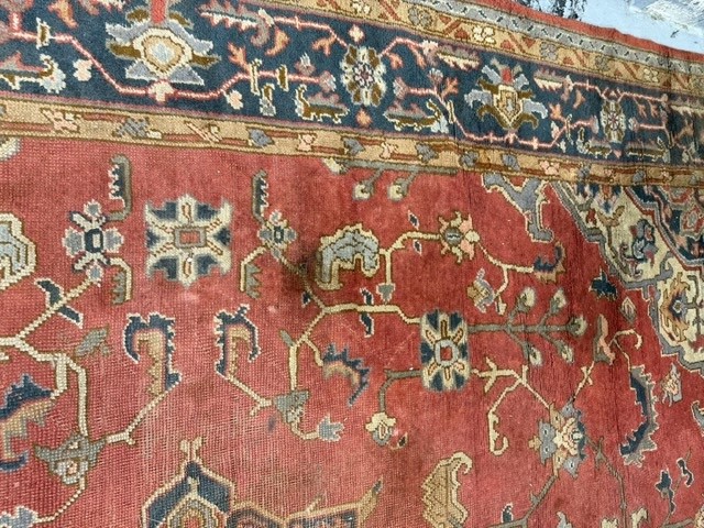 19th cent. Iranian Heriz carpet retailed by Maple & Co London (label attached). Red ground with - Image 7 of 7
