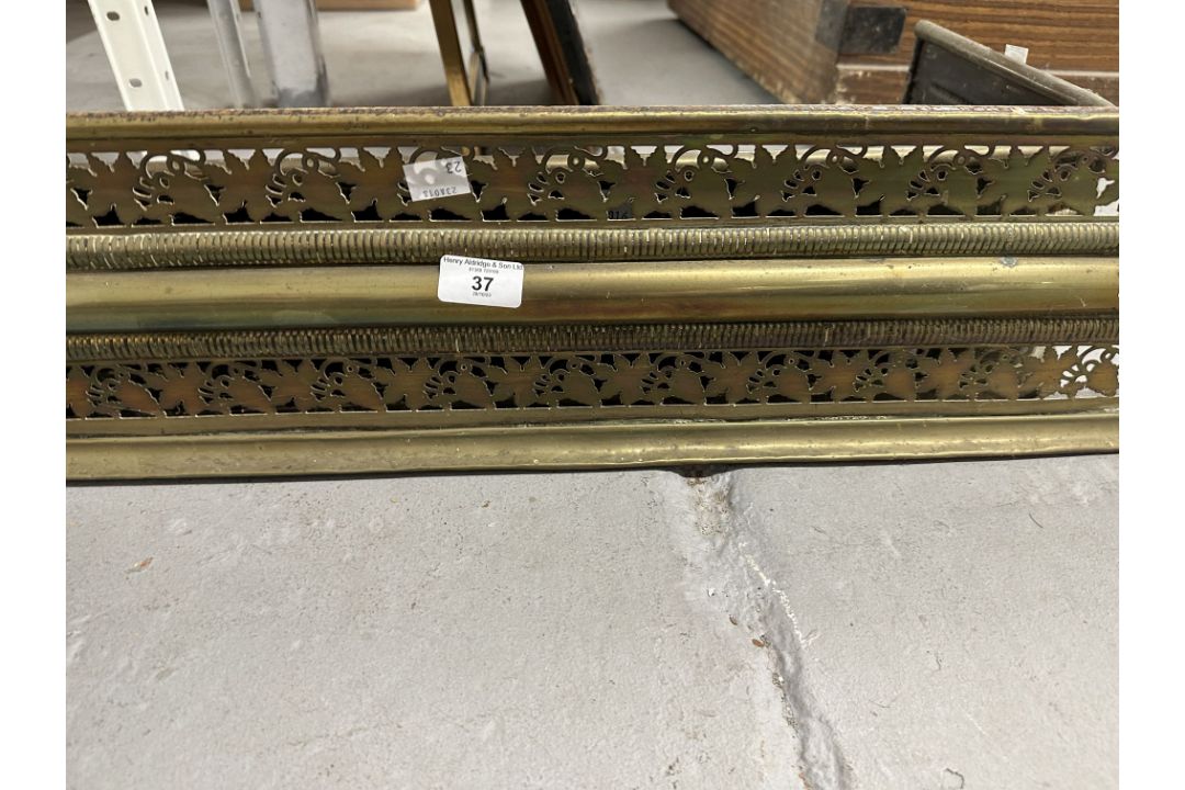Two brass fire fenders, the larger 47ins. x 7½ins. The smaller 31½ins. x 6ins. Both with - Image 2 of 2