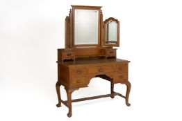 A VINTAGE TEAK DRESSING TABLE