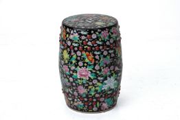 A BLACK GROUND FAMILLE ROSE PORCEALIN DRUM STOOL
