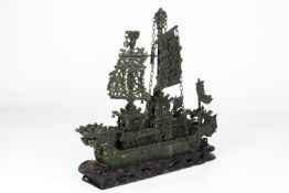 A LARGE CARVED GREEN HARDSTONE DRAGON BOAT