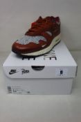 A pair of boxed as new Nike Air Max 1 Patta 'Waves' in Dark Russet (UK 10.5).