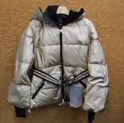 An as new Goldbergh Grace padded ski jacket in Gold (UK 10).