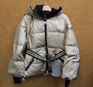 An as new Goldbergh Grace padded ski jacket in Gold (UK 10).