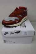A pair of boxed as new Nike Air Max 1 Patta 'Waves' in Dark Russet (UK 7.5).