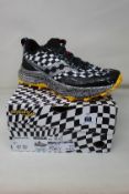 A pair of boxed as new Saucony Endorphine Trail yellow/black/white running trainers (Size UK 9 1/