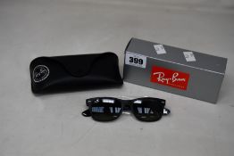 A pair of as new Ray Ban New Wayfarer Sunglasses.