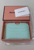 Three boxed as new Acne Studios Leather Card Holders in Pastel Green.
