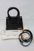 A Jacquemus Black Le Chiquito Noeud bag and dust bag (Slight dent mark to back of bag).