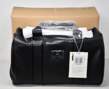 An as new Nova Harley Luxury Manhattan leather changing bag.