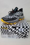 A pair of boxed as new Saucony Endorphine Trail yellow/black/white running trainers (Size UK 10).