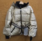 An as new Goldbergh Grace padded ski jacket in Gold (UK 10).