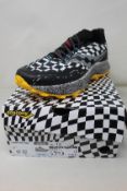 A pair of boxed as new Saucony Endorphine Trail yellow/black/white running trainers (Size UK 12).