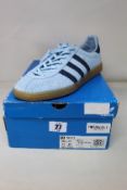 An as new pair of Adidas SNS GT trainers in Clear Sky/Collegiate Navy/Gold (Size UK 10).