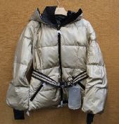 An as new Goldbergh Grace padded ski jacket in Gold (UK 10).