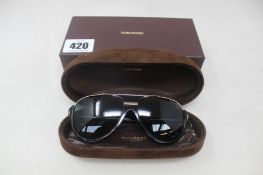 A pair of black Tom Ford Dimitry Aviator sunglasses with hard suede case.