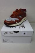 A pair of boxed as new Nike Air Max 1 Patta 'Waves' in Dark Russet (UK 9).