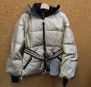 An as new Goldbergh Grace padded ski jacket in Gold (UK 10).