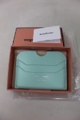 Three boxed as new Acne Studios Leather Card Holders in Pastel Green.
