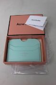 Three boxed as new Acne Studios Leather Card Holders in Pastel Green.