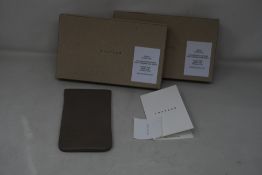 Two as new TSATSAS David Chipperfield Glasses Case in Grey/Gold.