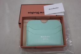Three boxed as new Acne Studios Leather Card Holders in Pastel Green.