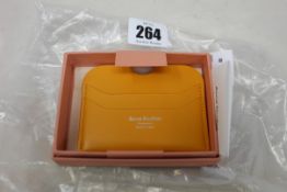 Three boxed as new Acne Studios Leather Card Holders in Pumpkin Orange.