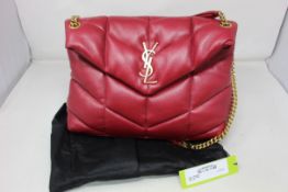 A pre-owned YSL red leather bag with front logo, magnetic closure, internal zip pocket and dust