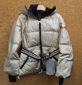 An as new Goldbergh Grace padded ski jacket in Gold (UK 10).