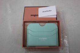 Three boxed as new Acne Studios Leather Card Holders in Pastel Green.