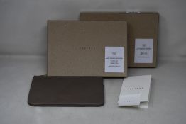 Two as new TSATSAS David Chipperfield Case 2 in Grey/Gold.