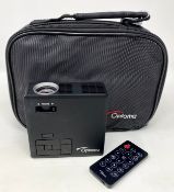 A pre-owned Optoma ML750E (LDMLUUZ) Ultra Portable HD LED Projector with Remote, PSU and Carry Case