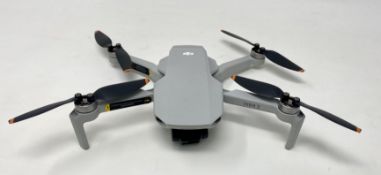 A pre-owned DJI Mavic Mini 2 Drone (No battery or other items included) (Untested, sold as seen).