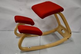 A pre-owned Varier Orthopaedic Kneeling Chair in Red.