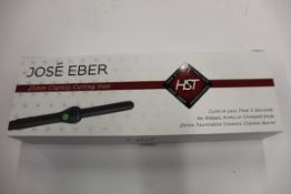 A boxed as new Jose' Eber HST 25mm Clipless Curling Iron.