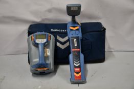 A pre-owned Radiodetection RD7100 cable and pipe locator and a TX-10 transmitter all in a soft carry